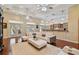 Open living space featuring a white sofa, hardwood floors, and a view to the pool area at 1109 Colson Rd, Plant City, FL 33567