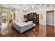 Bright living room with hardwood floors and a large entertainment center at 1109 Colson Rd, Plant City, FL 33567