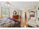 Bright main bedroom with hardwood floors and comfortable seating at 1109 Colson Rd, Plant City, FL 33567