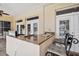 Outdoor kitchen features granite counters, sink, and stainless appliances perfect for entertaining near the pool at 1109 Colson Rd, Plant City, FL 33567