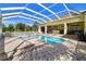 Beautiful backyard with a screened-in pool and patio, perfect for outdoor enjoyment and relaxation at 1109 Colson Rd, Plant City, FL 33567
