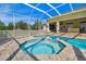 Inviting spa and pool area with sun-drenched patio, offering a luxurious outdoor retreat at 1109 Colson Rd, Plant City, FL 33567