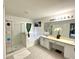 Bright bathroom featuring a bathtub, shower, vanity with double sinks, and tiled floor at 11122 Kempton Vista Dr, Riverview, FL 33579