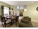 Bright dining area showcases a decorative table setting and leads to the entrance with a high ceiling at 11122 Kempton Vista Dr, Riverview, FL 33579
