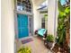 Cozy porch showcasing a bench with colorful cushions, decorative door, and charming welcome mat at 11122 Kempton Vista Dr, Riverview, FL 33579