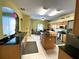 Spacious kitchen features granite countertops, stainless steel appliances, and a central island at 11122 Kempton Vista Dr, Riverview, FL 33579