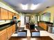 Bright kitchen featuring an island, stainless steel appliances, and adjacent dining area at 11122 Kempton Vista Dr, Riverview, FL 33579