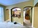 View into the kitchen, which features wood cabinets, black countertops and stainless steel appliances at 11122 Kempton Vista Dr, Riverview, FL 33579