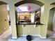 View into the kitchen, which features wood cabinets, black countertops and stainless steel appliances at 11122 Kempton Vista Dr, Riverview, FL 33579