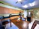 The kitchen features wooden cabinets, black countertops, and a dining area for casual meals at 11122 Kempton Vista Dr, Riverview, FL 33579