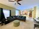 Spacious living room offering neutral colors, carpet flooring and view of the kitchen at 11122 Kempton Vista Dr, Riverview, FL 33579