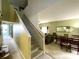 Open-concept living area featuring a staircase, dining set, and cozy seating arrangement at 11122 Kempton Vista Dr, Riverview, FL 33579
