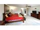 Large main bedroom with carpet flooring, ceiling fan, and a walk-in closet, offering space and comfort at 11122 Kempton Vista Dr, Riverview, FL 33579