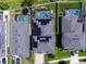 Aerial view of home rooftops equipped with solar panels, showcasing their energy efficiency at 11219 Paddock Manor Ave, Riverview, FL 33569