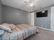 Bedroom featuring carpet, a ceiling fan, and natural lighting from a window at 11219 Paddock Manor Ave, Riverview, FL 33569