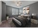 Cozy bedroom featuring neutral walls, plush bedding, and bright natural light at 11219 Paddock Manor Ave, Riverview, FL 33569