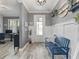 Stylish entryway with a bench, decorative accents, and neutral paint scheme at 11219 Paddock Manor Ave, Riverview, FL 33569