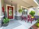Inviting front porch with a cozy seating area and decorative elements adding charm at 11219 Paddock Manor Ave, Riverview, FL 33569