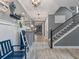 Hallway featuring modern decor, a staircase, and access to other rooms at 11219 Paddock Manor Ave, Riverview, FL 33569