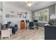 Bright office featuring neutral paint, shelving, and a modern ceiling fan at 11219 Paddock Manor Ave, Riverview, FL 33569