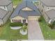 Aerial view of home featuring manicured landscaping, a brick driveway, and a well-maintained lawn at 11308 Chilly Water Ct, Riverview, FL 33569