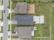 Aerial view of homes showing roof and yard details with a focus on the geometric design of lawns and roofs at 11308 Chilly Water Ct, Riverview, FL 33569