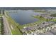 Aerial view of a beautiful lakefront neighborhood with homes on spacious lots, and well maintained lawns at 11308 Chilly Water Ct, Riverview, FL 33569