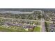 Aerial view of a neighborhood with homes on spacious lots, and well maintained lawns near a lake at 11308 Chilly Water Ct, Riverview, FL 33569