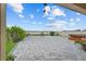 Enjoy this backyard patio space with a beautiful water view, perfect for outdoor relaxation and entertaining at 11308 Chilly Water Ct, Riverview, FL 33569