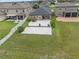 View of the backyard featuring a paved patio, a hot tub, mature trees, and a white fence at 11308 Chilly Water Ct, Riverview, FL 33569