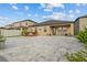 Wide backyard featuring an expansive patio, perfect for outdoor gatherings and relaxation at 11308 Chilly Water Ct, Riverview, FL 33569