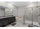 Elegant bathroom with a double sink vanity, shower, and tub at 11308 Chilly Water Ct, Riverview, FL 33569