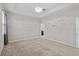 Cozy bedroom with neutral carpet, modern lighting, and serene atmosphere at 11308 Chilly Water Ct, Riverview, FL 33569