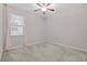 Bedroom features carpet, ceiling fan, natural light, and light pink curtains at 11308 Chilly Water Ct, Riverview, FL 33569