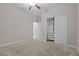 Bedroom features a ceiling fan, carpeted floor, an open closet, and a doorway to another room at 11308 Chilly Water Ct, Riverview, FL 33569