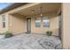 Cozy covered patio with a tiled floor and views of the backyard, perfect for relaxing and entertaining at 11308 Chilly Water Ct, Riverview, FL 33569