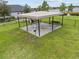 Community dog park featuring benches and waste disposal stations for pet owners' convenience at 11308 Chilly Water Ct, Riverview, FL 33569