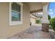 Front exterior detail featuring stone columns and a brick driveway at 11308 Chilly Water Ct, Riverview, FL 33569