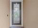 Front door detail featuring a glass door and electronic lock at 11308 Chilly Water Ct, Riverview, FL 33569