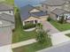 Inviting single Gathering home with a well-manicured lawn, mature shrubbery, and a paved driveway to a two car garage at 11308 Chilly Water Ct, Riverview, FL 33569
