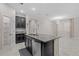 Kitchen island with granite countertop, sink, and dishwasher overlooks open living area at 11308 Chilly Water Ct, Riverview, FL 33569