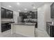 Modern kitchen features dark wood cabinets, granite countertops, and stainless steel appliances at 11308 Chilly Water Ct, Riverview, FL 33569