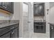 Kitchen featuring dark cabinets, granite countertops, and a spacious walk-in pantry at 11308 Chilly Water Ct, Riverview, FL 33569