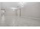 Spacious living room with tile floors and modern lighting at 11308 Chilly Water Ct, Riverview, FL 33569