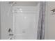 Close-up of a tiled shower/tub with a shower curtain, shower head, faucet and soap dish at 11308 Chilly Water Ct, Riverview, FL 33569