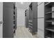 Spacious walk-in closet featuring custom shelving and ample storage, perfect for organization and convenience at 11308 Chilly Water Ct, Riverview, FL 33569