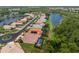 Aerial view of a well-maintained single-Gathering home with an enclosed pool and mature landscaping at 11343 Dancing River Dr, Venice, FL 34292