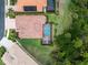 Aerial view showing the home, screened pool area, lush backyard, and proximity to natural surroundings at 11343 Dancing River Dr, Venice, FL 34292