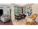 Bright breakfast nook adjacent to the kitchen with a view of the screened patio at 11343 Dancing River Dr, Venice, FL 34292