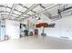 Spacious garage with storage cabinets, painted floor, ample lighting, and room for parking at 11343 Dancing River Dr, Venice, FL 34292